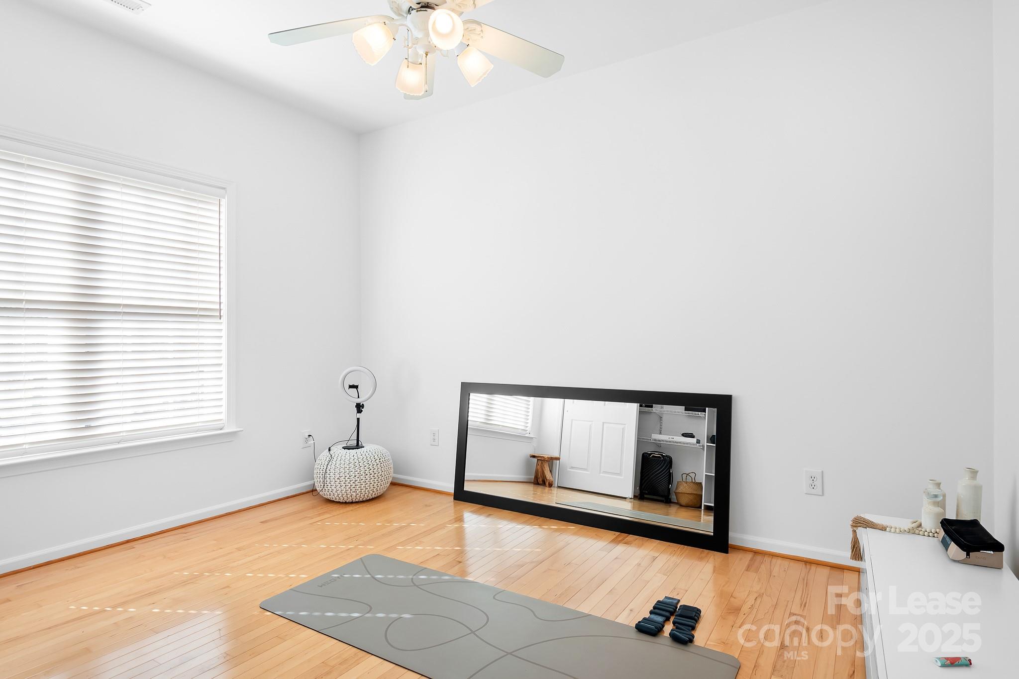 7277 Willowbrook Drive Denver, NC 28037 - Photo 22 of 33 a view of room with window and hardwood floor