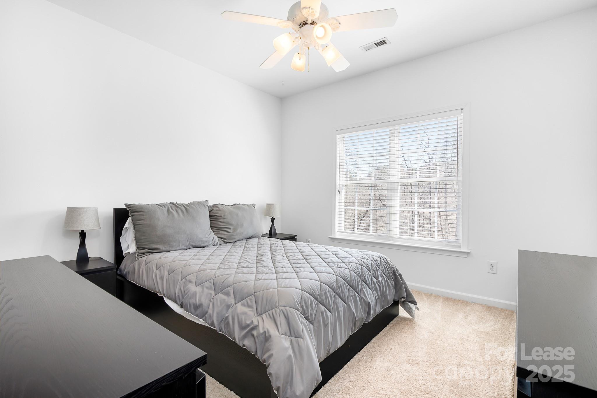 7277 Willowbrook Drive Denver, NC 28037 - Photo 30 of 33 a bedroom with bed and window