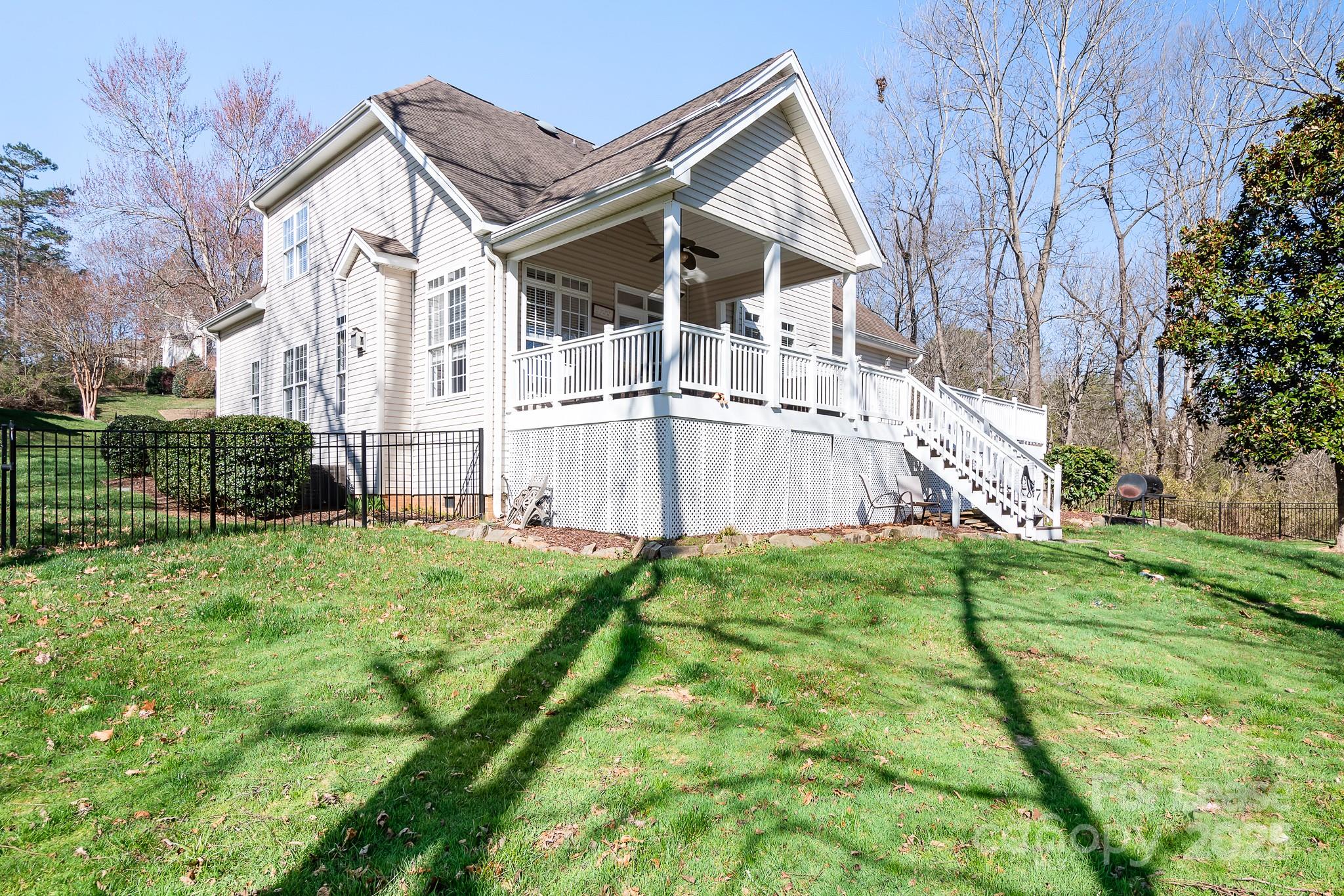 7277 Willowbrook Drive Denver, NC 28037 - Photo 31 of 33 a view of a house with backyard and trees