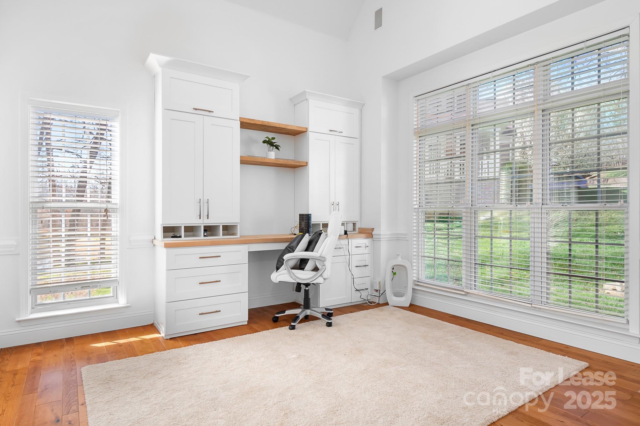 7277 Willowbrook Drive Denver, NC 28037 - Photo 7 of 33 a view of a bedroom with workspace and windows
