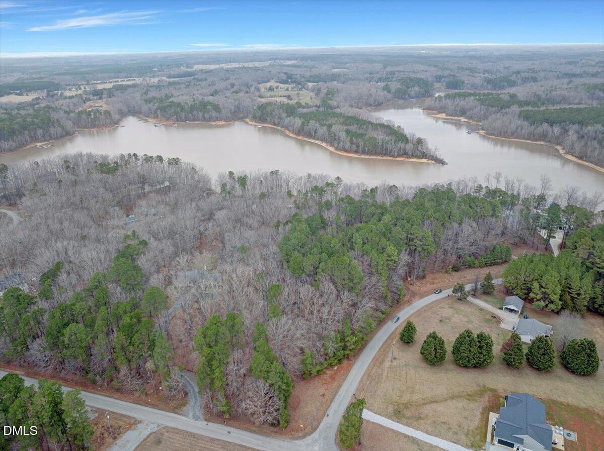 12 Piney Ridge Road Clarksville, VA 23927 - Photo 3 of 21 a view of a lake with a mountain in the background