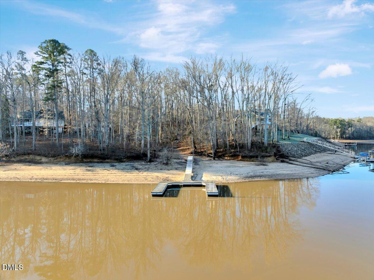 12 Piney Ridge Road Clarksville, VA 23927 - Photo 8 of 21 a view of a swimming pool with an outdoor space and seating area
