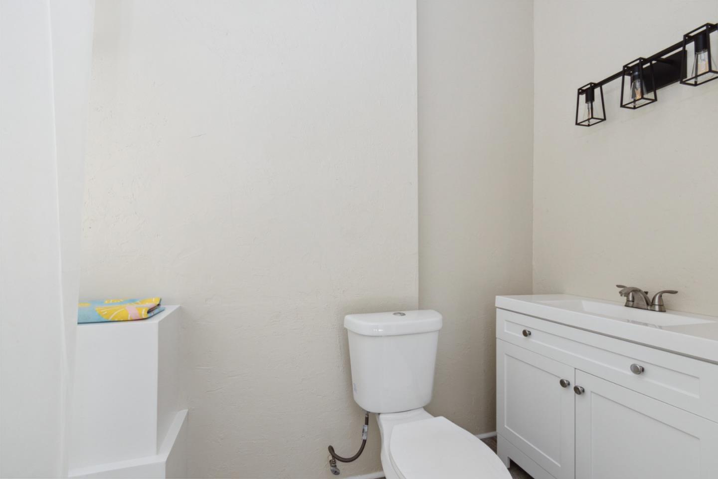 520 Laguna Creek Road Los Gatos, CA 95033 - Photo 14 of 75 a white toilet sitting next to a bathroom sink