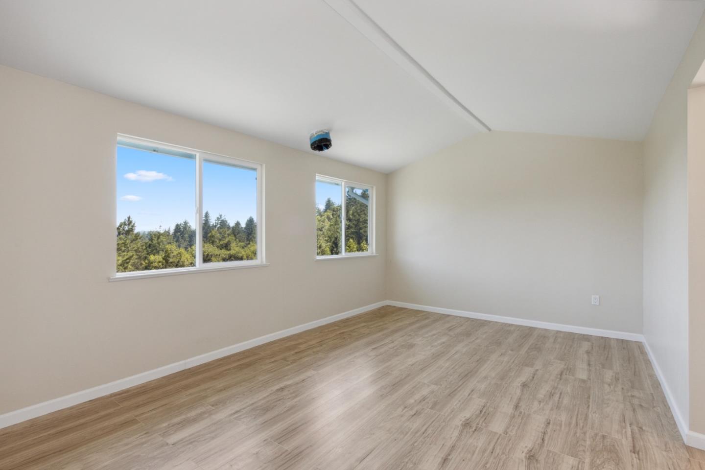 520 Laguna Creek Road Los Gatos, CA 95033 - Photo 21 of 75 a view of an empty room with wooden floor and a window