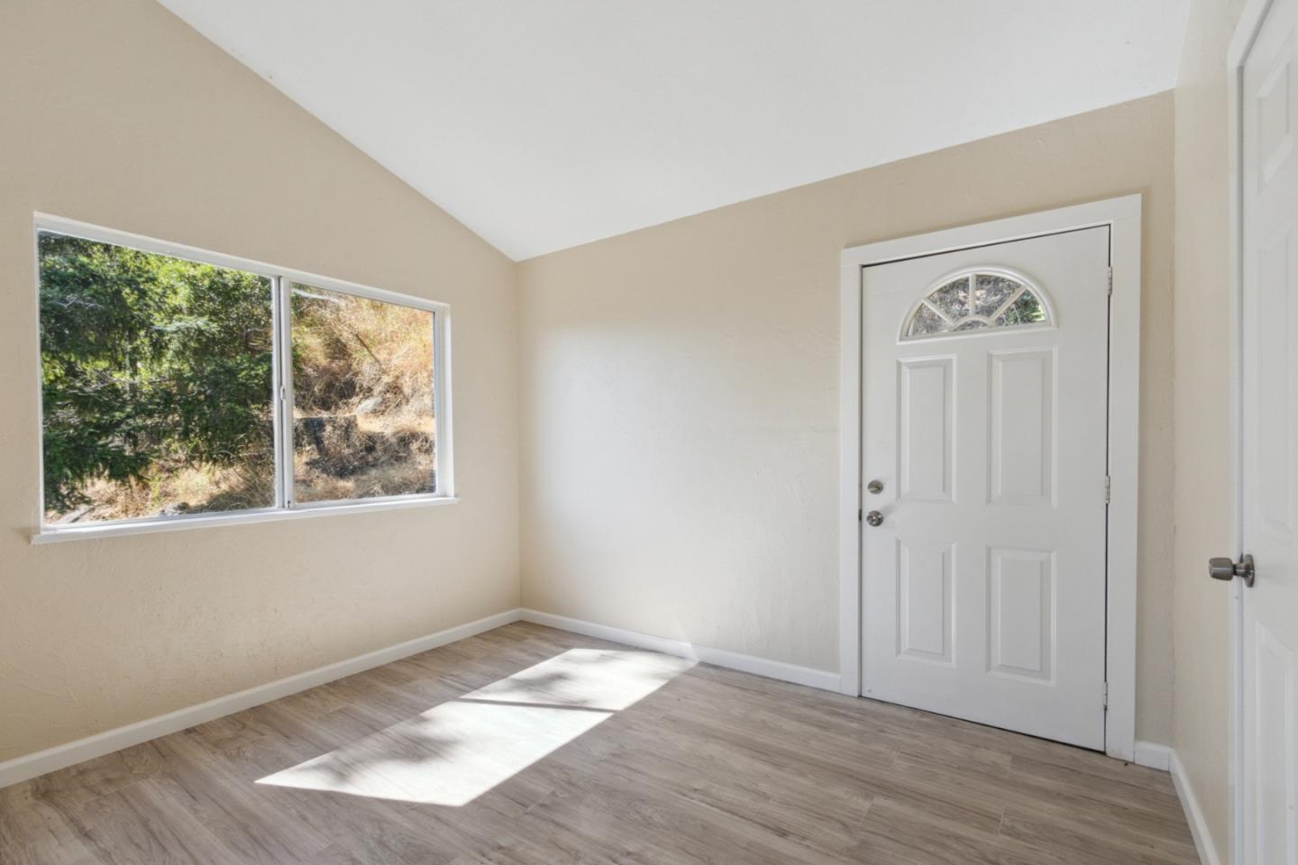 520 Laguna Creek Road Los Gatos, CA 95033 - Photo 23 of 75 an empty room with wooden floor and a window