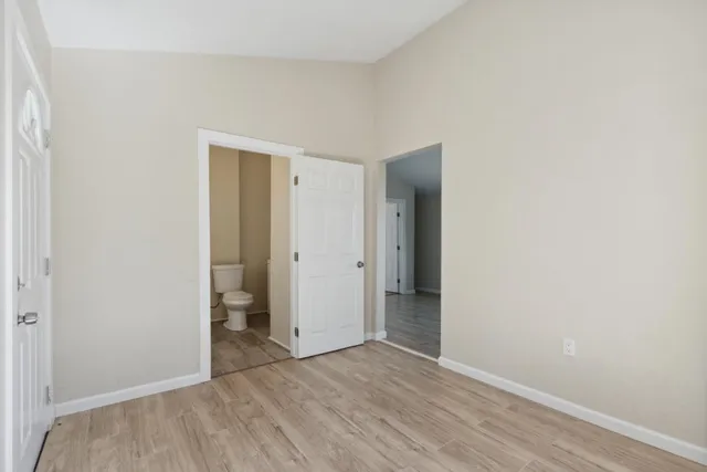 a view of an empty room with a window