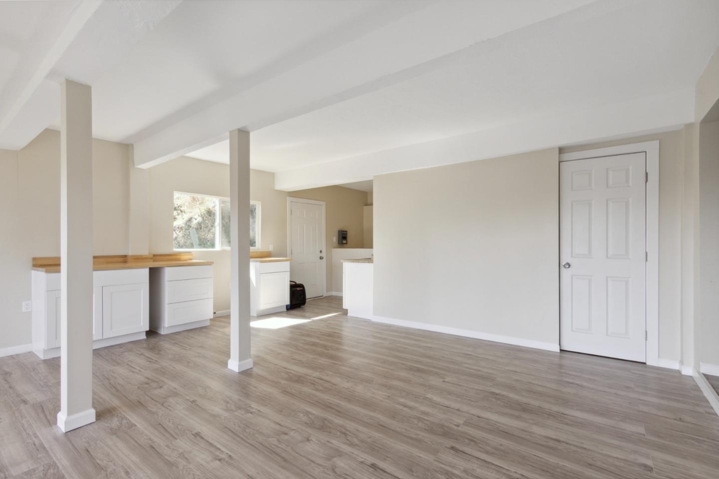 520 Laguna Creek Road Los Gatos, CA 95033 - Photo 7 of 75 a view of a kitchen and an empty room with wooden floor and a kitchen