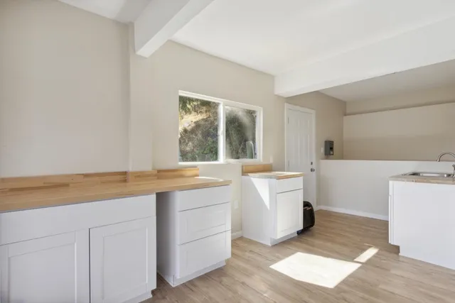 a white toilet sitting next to a bathroom sink