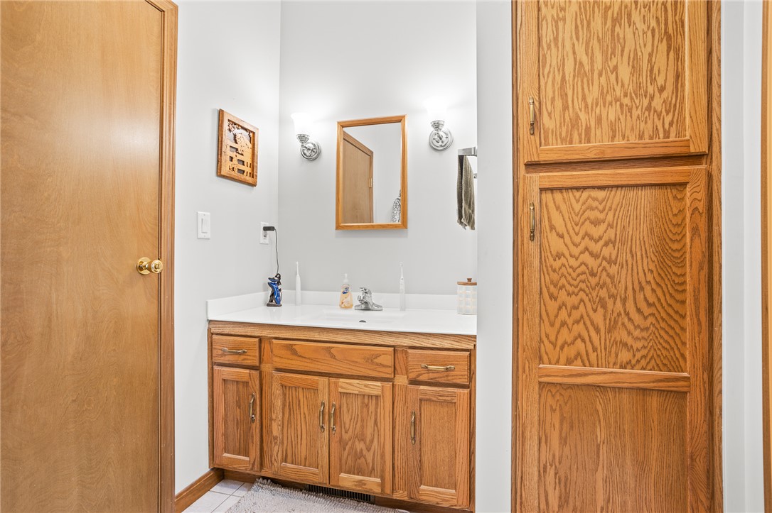 4222 Ramsey Road Springfield, OH 45502 - Photo 52 of 79 This bathroom features a functional vanity, offering ample storage and a bright, inviting atmosphere.