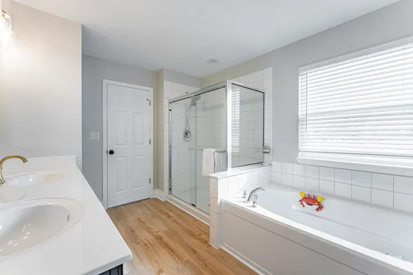 a bathroom with a bathtub and a sink