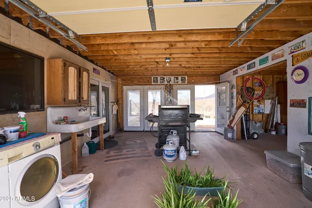 a bedroom with furniture and a window