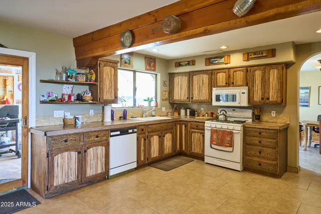 a view of a building with snow on the roadside