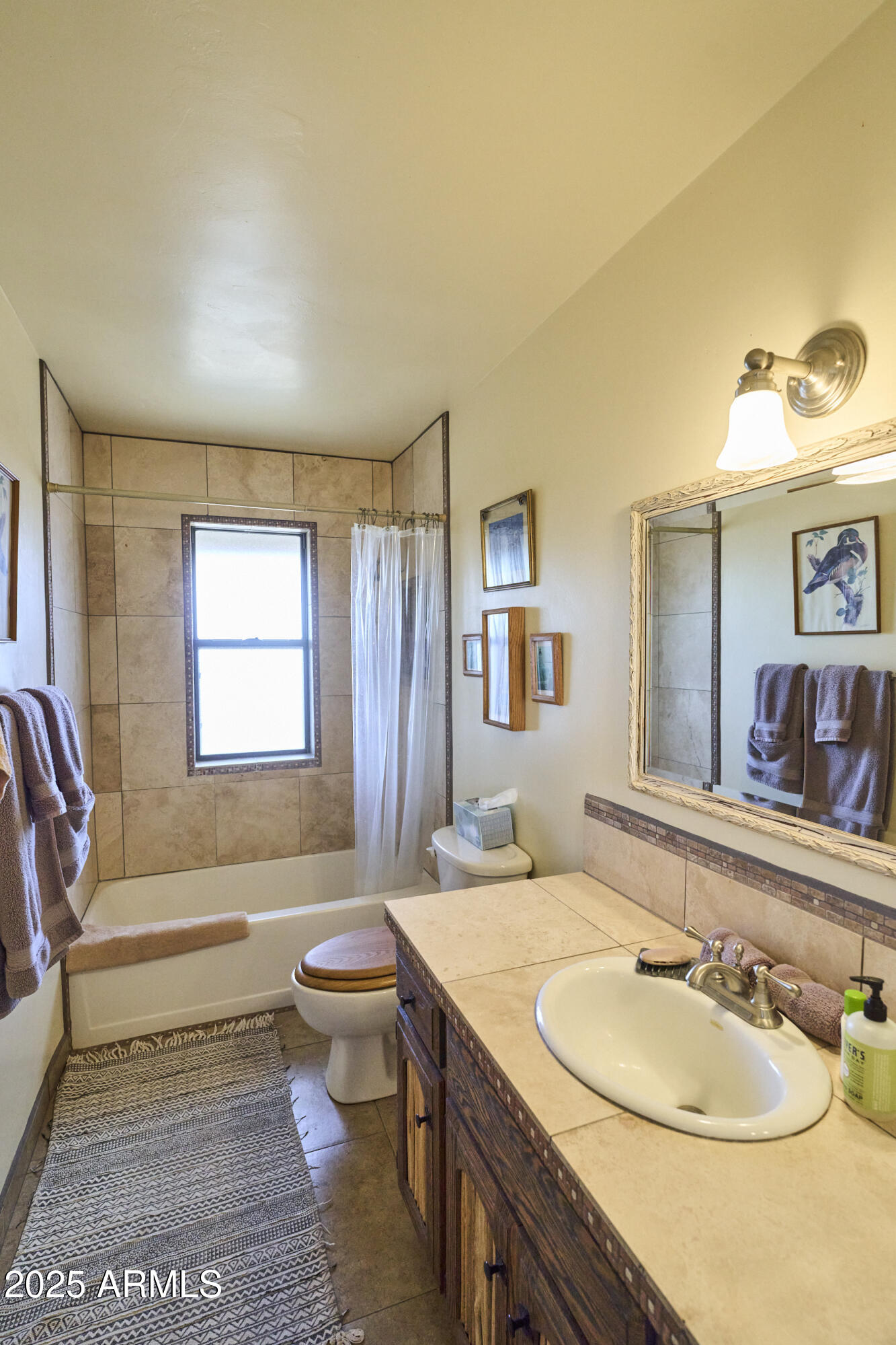 Undisclosed Address Bisbee, AZ 85603 - Photo 35 of 78 a bathroom with a granite countertop sink mirror vanity and toilet