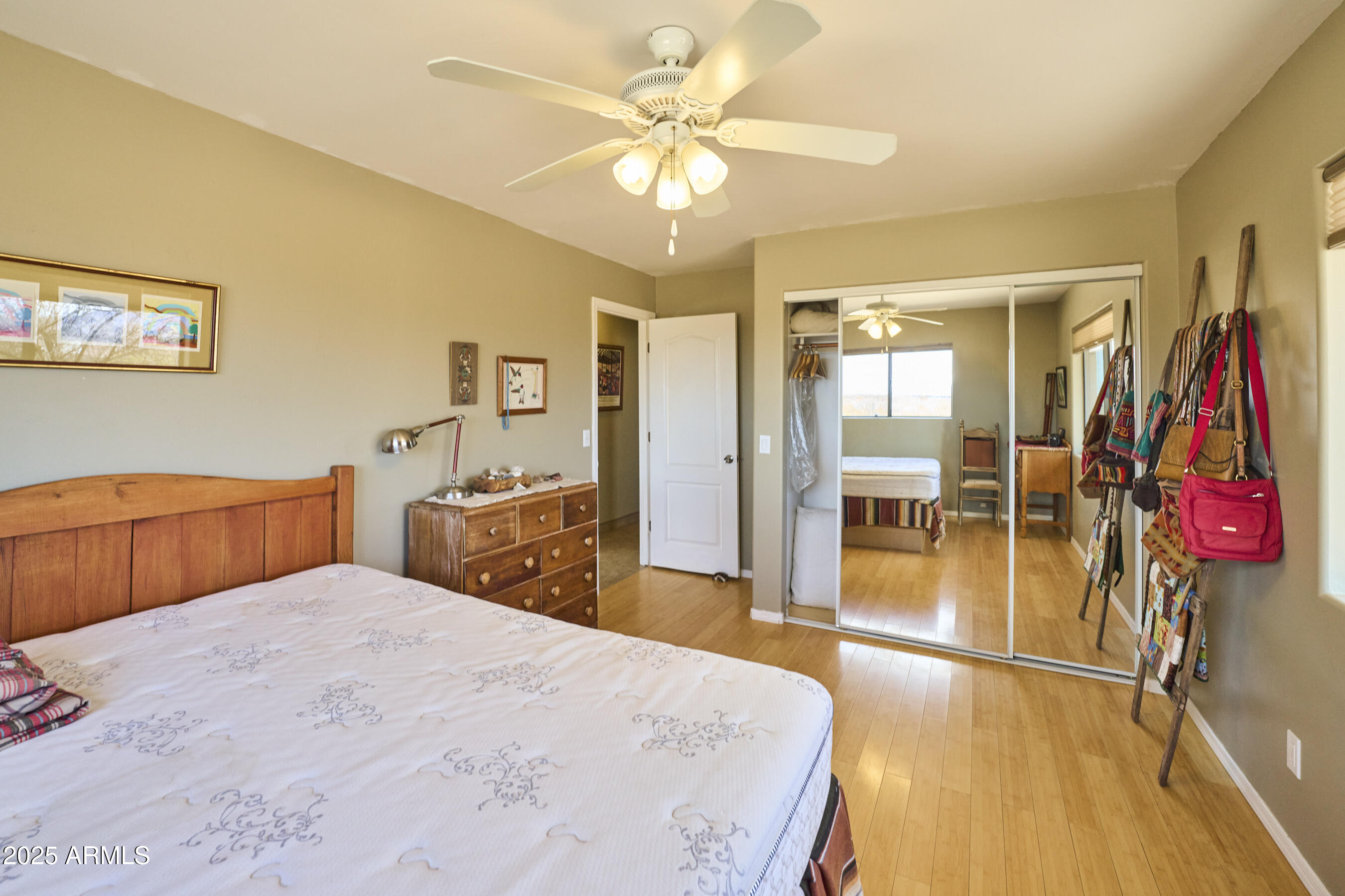 Undisclosed Address Bisbee, AZ 85603 - Photo 36 of 78 a bedroom with a bed and a chandelier