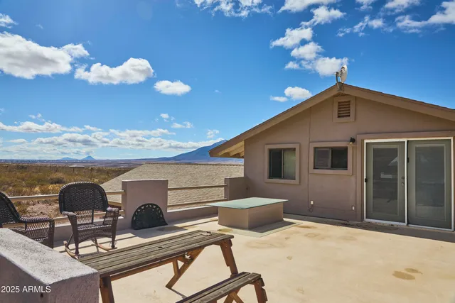 a view of a livingroom with furniture and a bookshelf