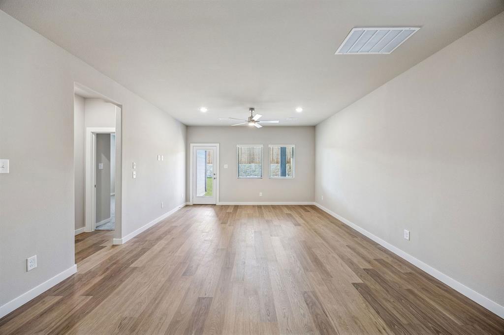 333 Millwood Road Lavon, TX 75166 - Photo 12 of 36 Living and Dining Room in the Willow home plan by Trophy Signature Homes – REPRESENTATIVE PHOTO