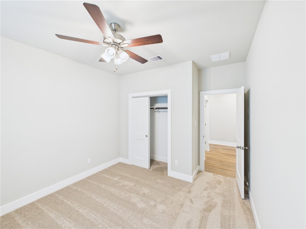 5306 Lyle Place Bryan, TX 77807 - Photo 15 of 18 a view of a livingroom with a ceiling fan & a ceiling fan
