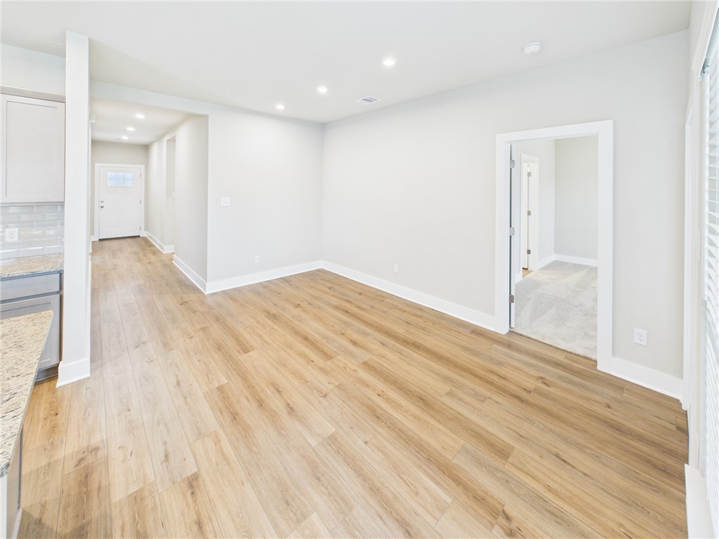 5306 Lyle Place Bryan, TX 77807 - Photo 4 of 18 wooden floor in an empty room with a window