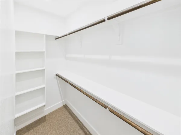 a view of an empty walk in closet