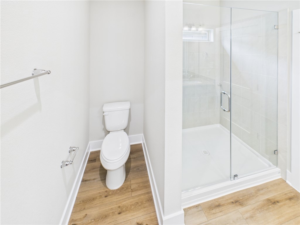 5306 Lyle Place Bryan, TX 77807 - Photo 10 of 18 a bathroom with a toilet and a shower