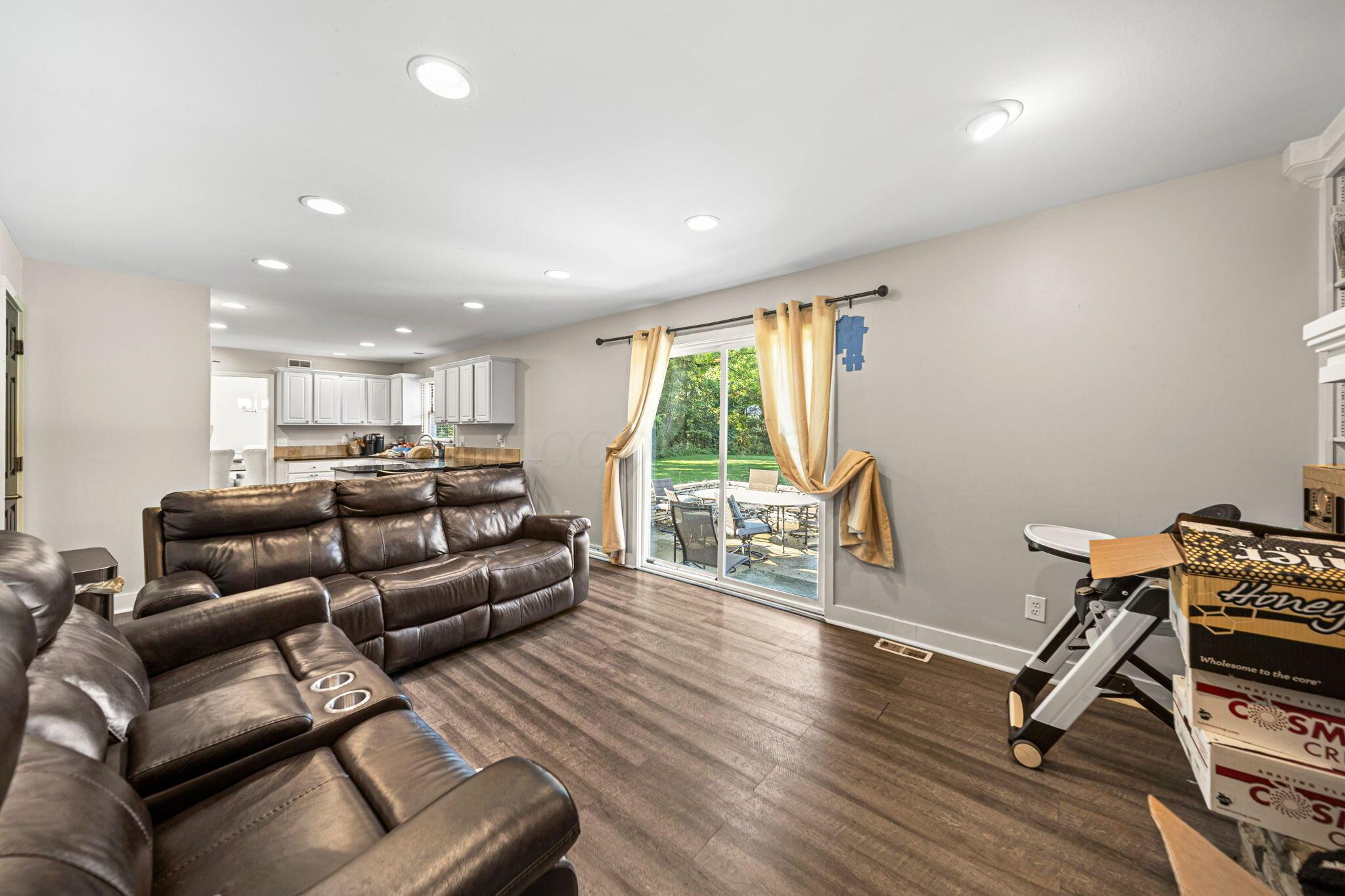 6344 Post Road Dublin, OH 43017 - Photo 12 of 45 Wood-finish flooring throughout, recessed lighting, and a sliding glass door