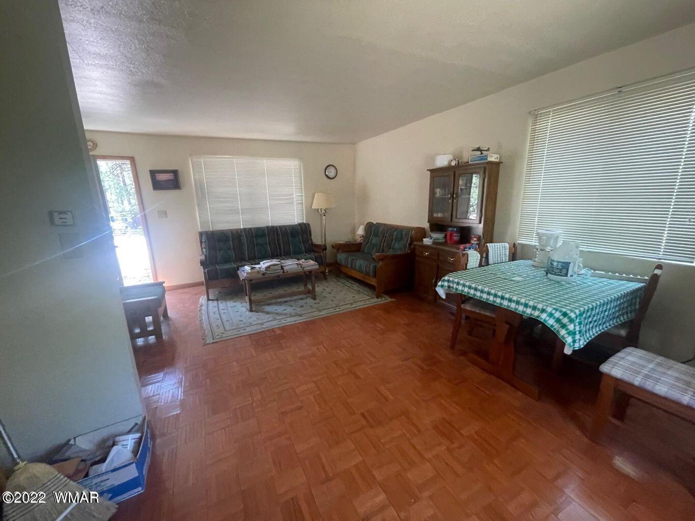 2891 Tracy Road Overgaard, AZ 85933 - Photo 5 of 9 a living room with furniture and wooden floor