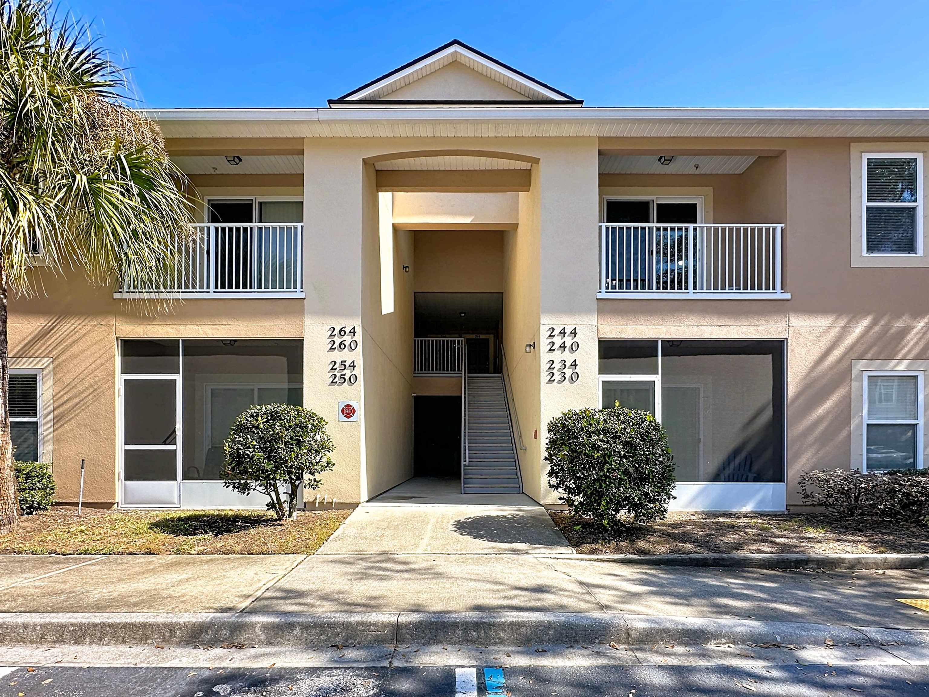 View of apartment building / complex featuring stairway