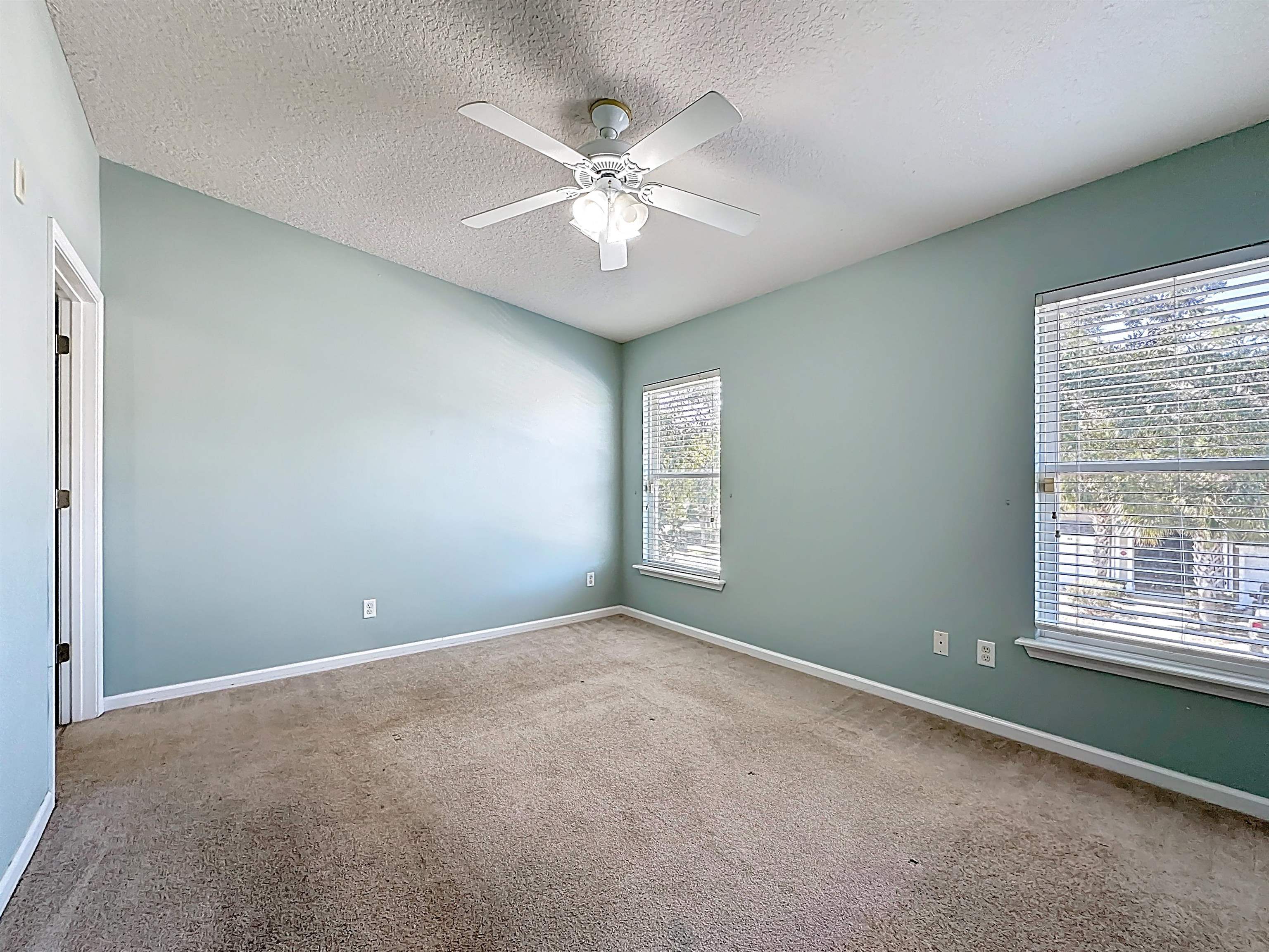 240 Golden Lake Loop St. Augustine, FL 32084 - Photo 16 of 31 Carpeted spare room featuring a ceiling fan and a textured ceiling