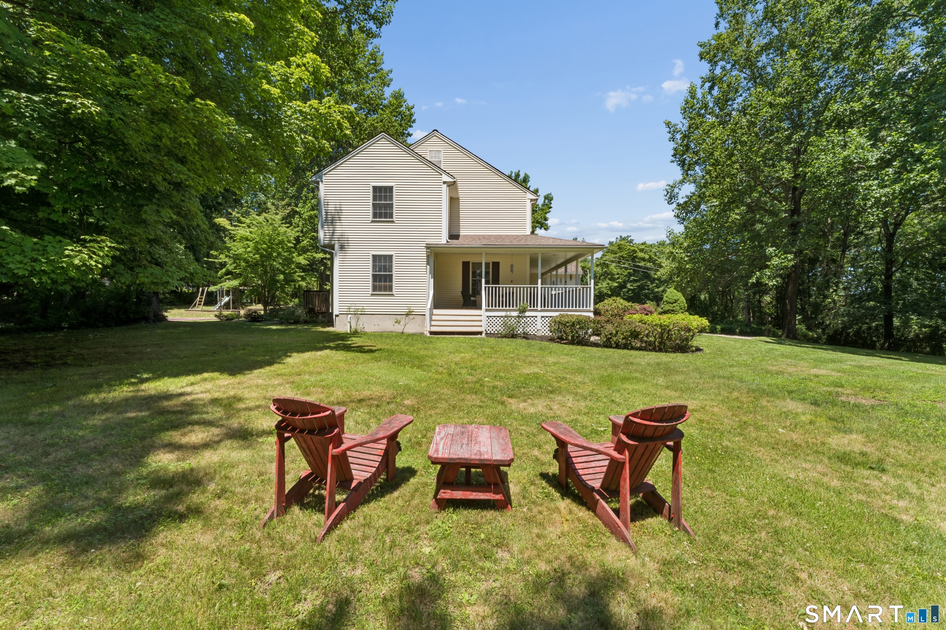 10 Ferris Road Newtown, CT 06470 - Photo 4 of 40 a view of a house with backyard and sitting area