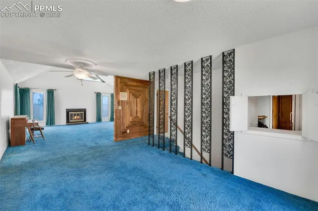 a view of a dining room with furniture and window