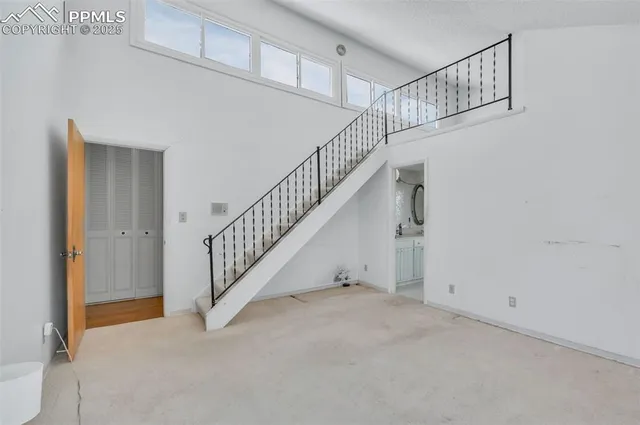 a bed room with a bed and a chandelier