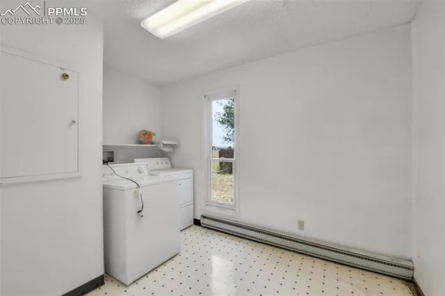 a view of an empty room with a fireplace