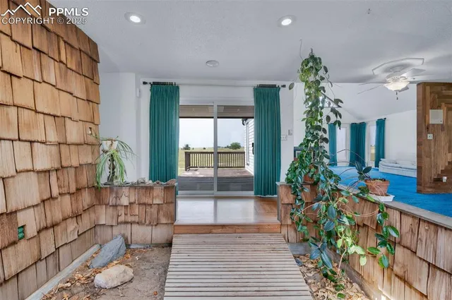 a view of balcony with wooden floor