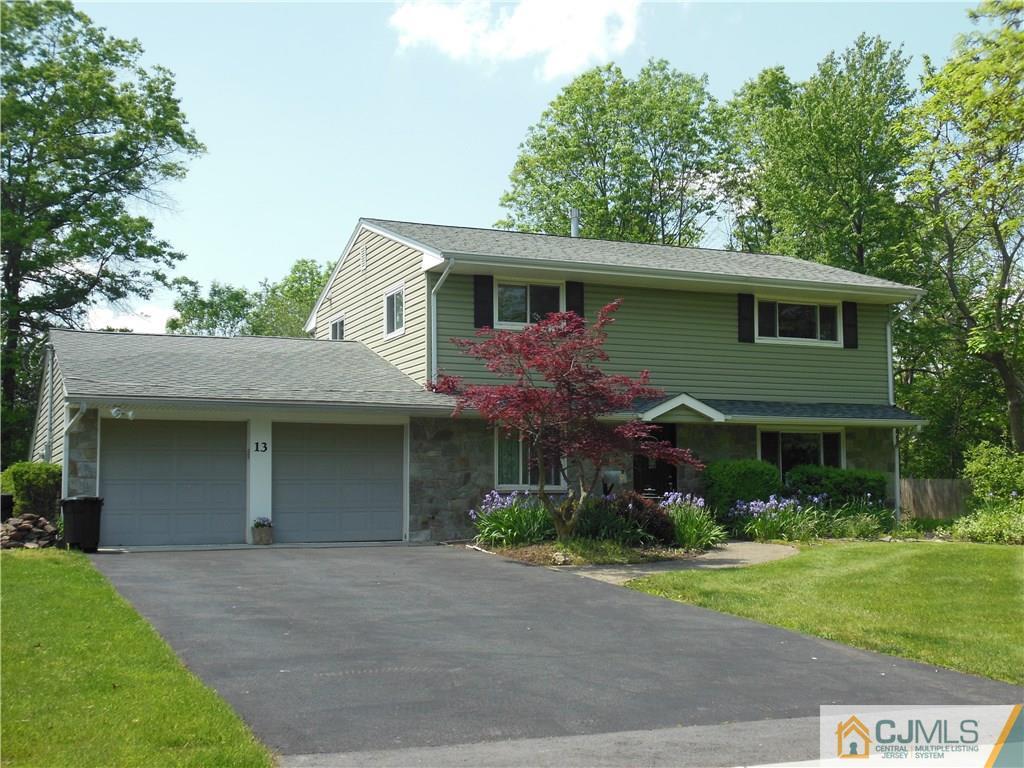 13 Russett Road Somerset, NJ 08873 - Photo 1 of 20 a front view of a house with garden