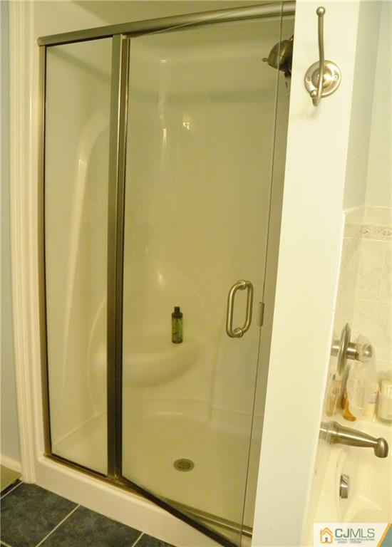 13 Russett Road Somerset, NJ 08873 - Photo 12 of 20 a bathroom with a glass shower door