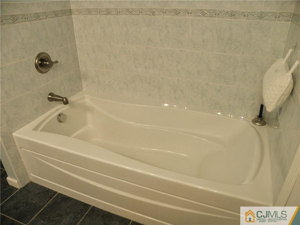 13 Russett Road Somerset, NJ 08873 - Photo 13 of 20 a bathroom with a bathtub