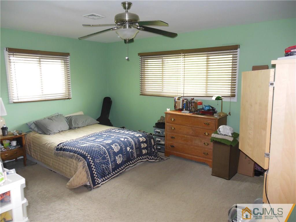 13 Russett Road Somerset, NJ 08873 - Photo 14 of 20 a bedroom with bed and window