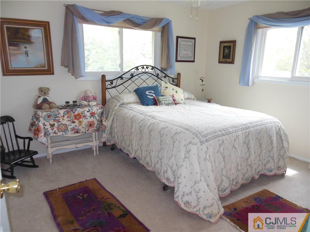 13 Russett Road Somerset, NJ 08873 - Photo 15 of 20 a bedroom with a bed and window