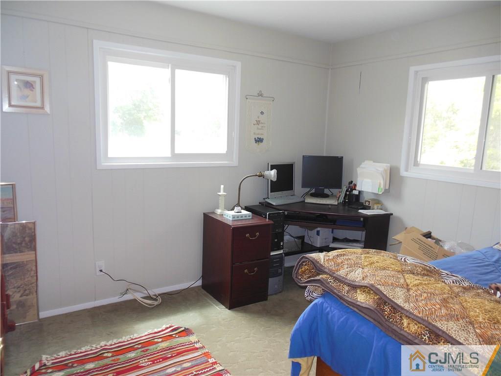 13 Russett Road Somerset, NJ 08873 - Photo 16 of 20 a bedroom with a bed and a window