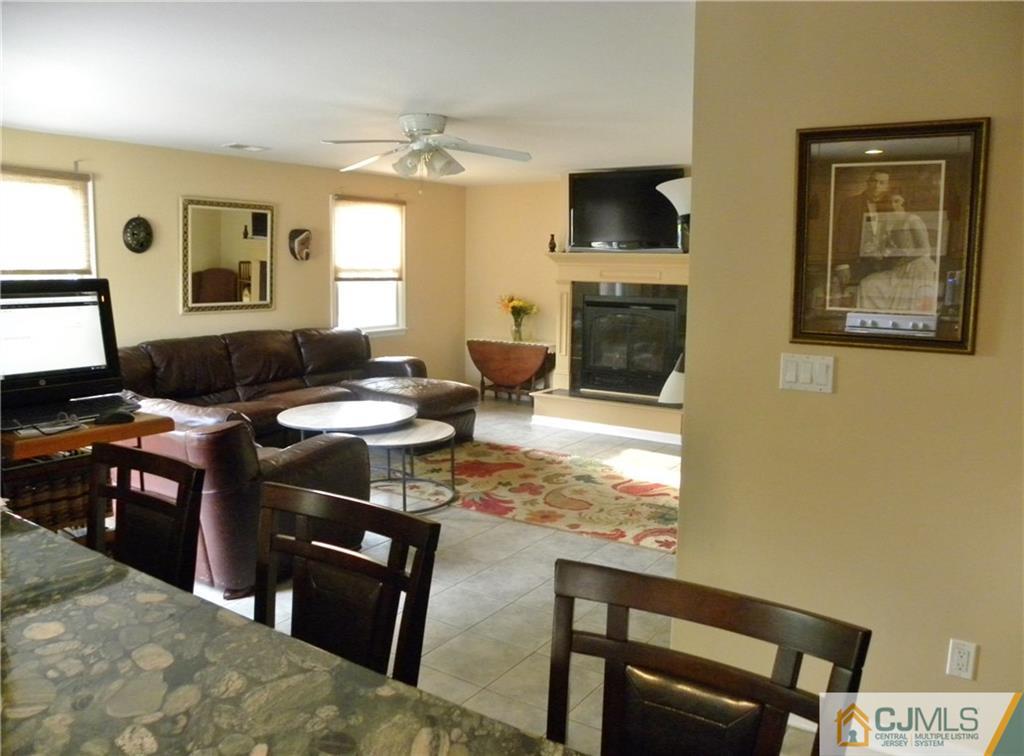 13 Russett Road Somerset, NJ 08873 - Photo 7 of 20 a living room with furniture and a flat screen tv