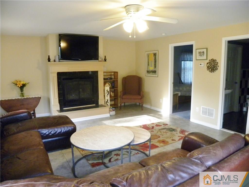 13 Russett Road Somerset, NJ 08873 - Photo 8 of 20 a living room with furniture and a fireplace