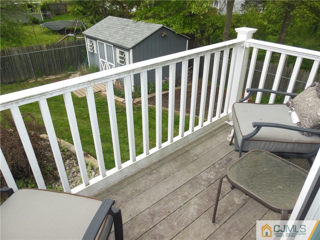 13 Russett Road Somerset, NJ 08873 - Photo 10 of 20 a view of a chair and table in the balcony