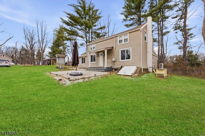 28 Wagners Lane Warren, NJ 07059 - Photo 12 of 50 a front view of house with a garden and patio