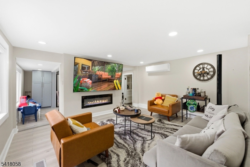 28 Wagners Lane Warren, NJ 07059 - Photo 15 of 50 a living room with furniture and a flat screen tv