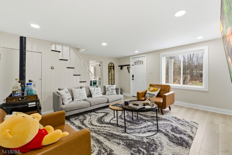 28 Wagners Lane Warren, NJ 07059 - Photo 16 of 50 a living room with furniture and a window