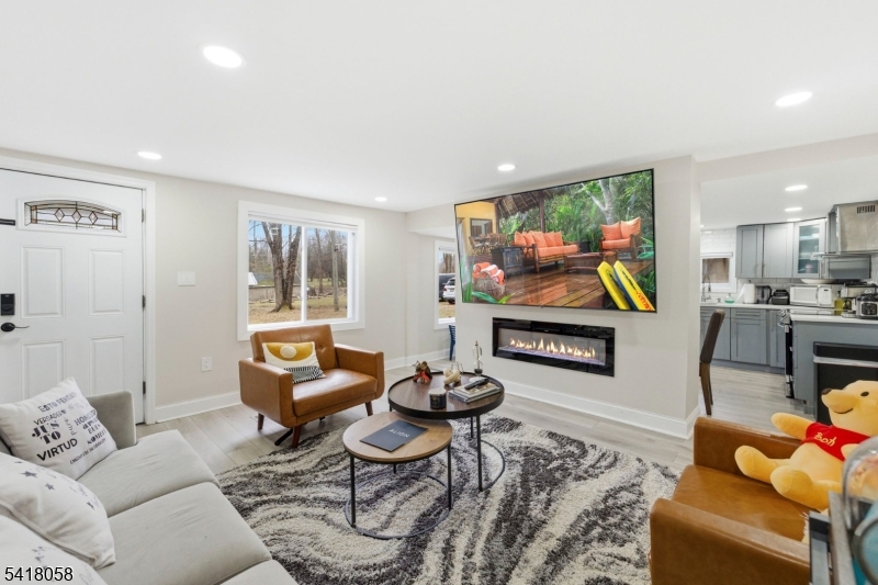 28 Wagners Lane Warren, NJ 07059 - Photo 18 of 50 a living room with furniture and a flat screen tv