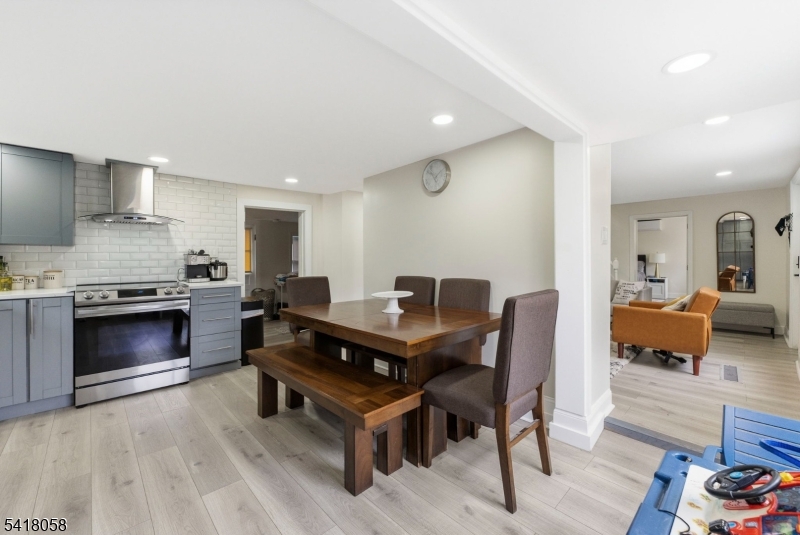 28 Wagners Lane Warren, NJ 07059 - Photo 20 of 50 a living room with furniture and a fireplace