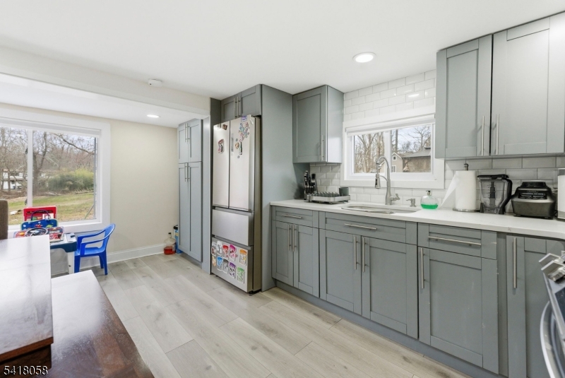 28 Wagners Lane Warren, NJ 07059 - Photo 23 of 50 a kitchen with a sink cabinets and window