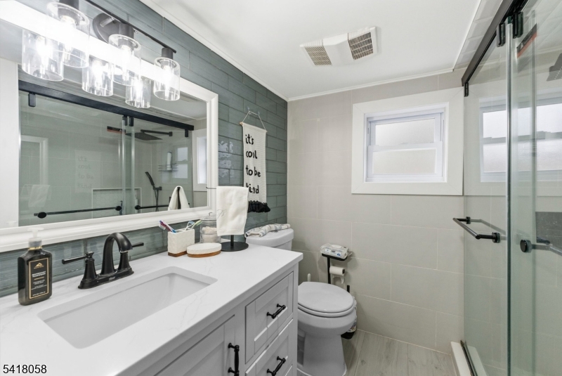 28 Wagners Lane Warren, NJ 07059 - Photo 26 of 50 a bathroom with a sink toilet and shower