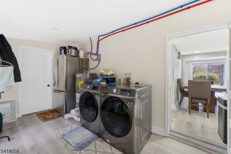 28 Wagners Lane Warren, NJ 07059 - Photo 27 of 50 a view of living room washer and dryer